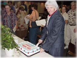 Mr. Jefferson (J.D. Sutton) cuts his birthday cake.